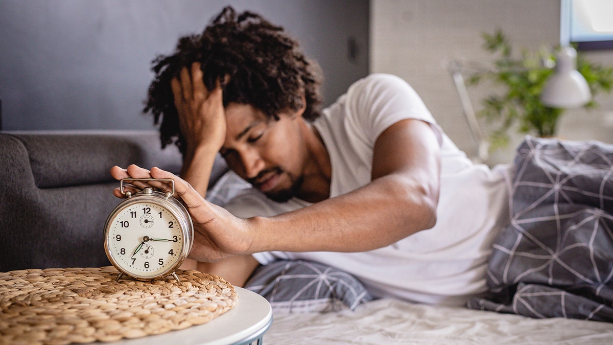 man wakes up stressed
