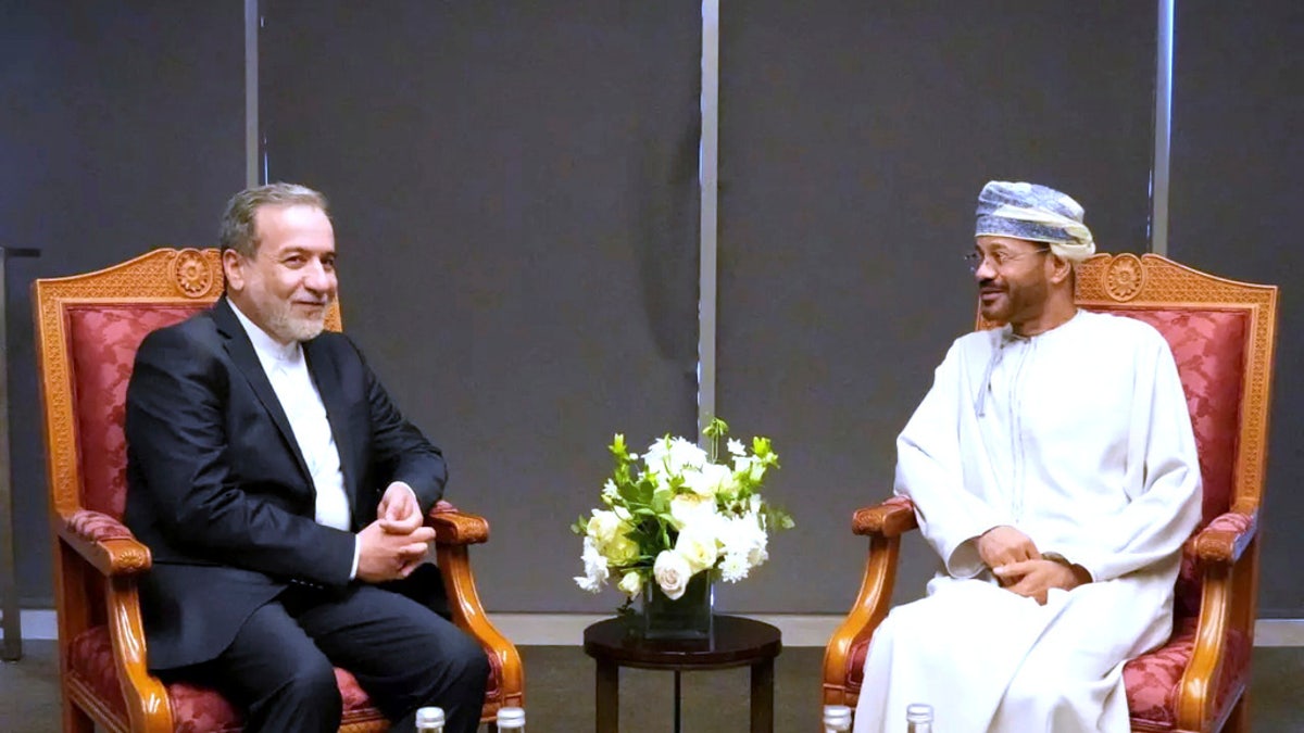 Iranian Foreign Minister Abbas Araghchi, left, meets his Omani counterpart Sayyid Badr Albusaidi