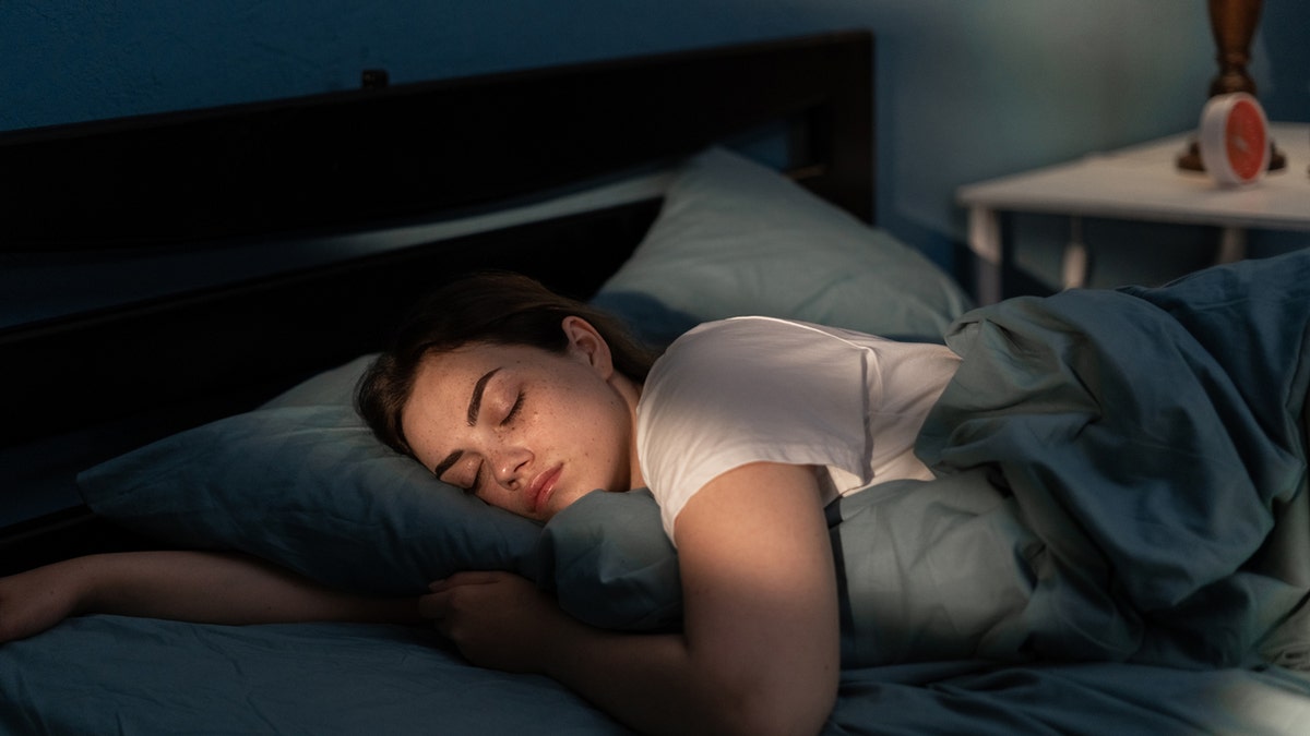 A woman sleeping in bed
